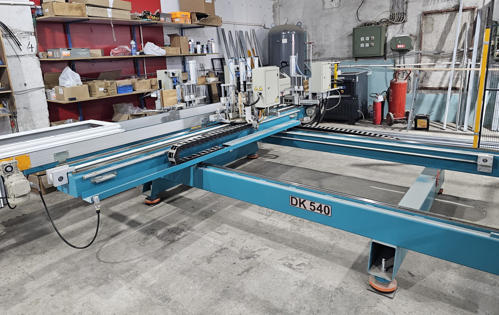 Workshop technician working on PVC window assembly