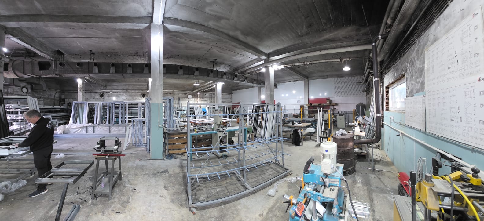 Workshop technician working on PVC window assembly